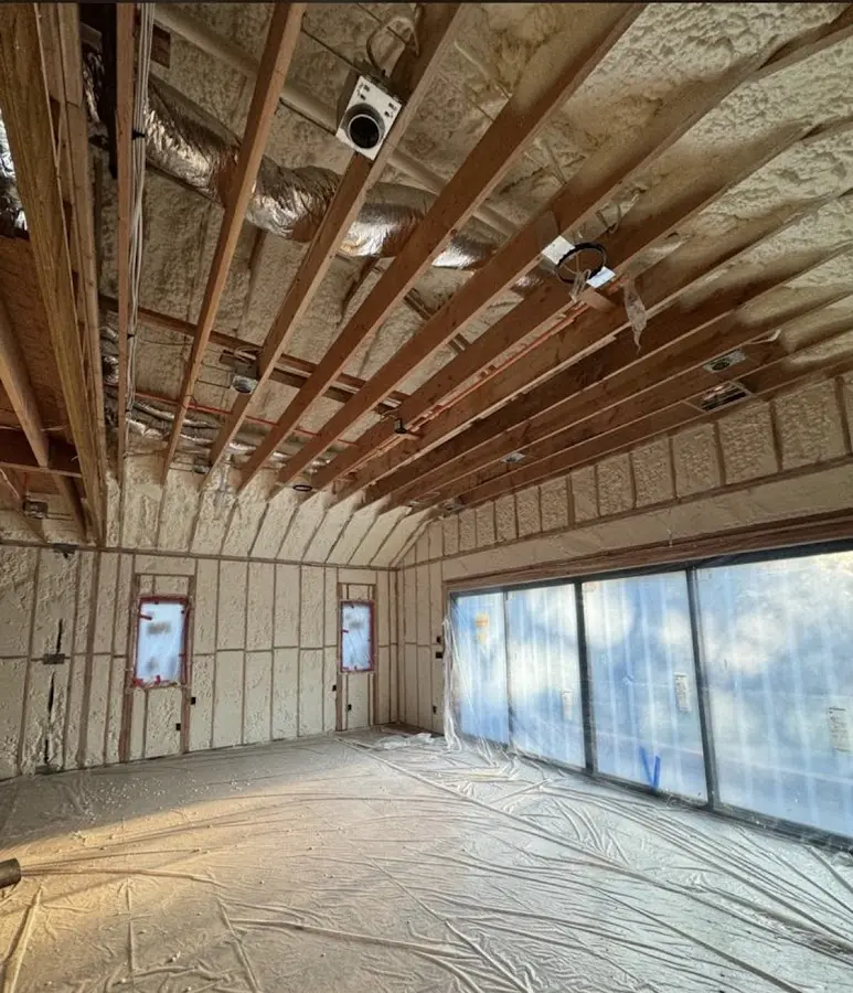 Interior walls and ceiling insulated with spray foam during new construction in Eastchester